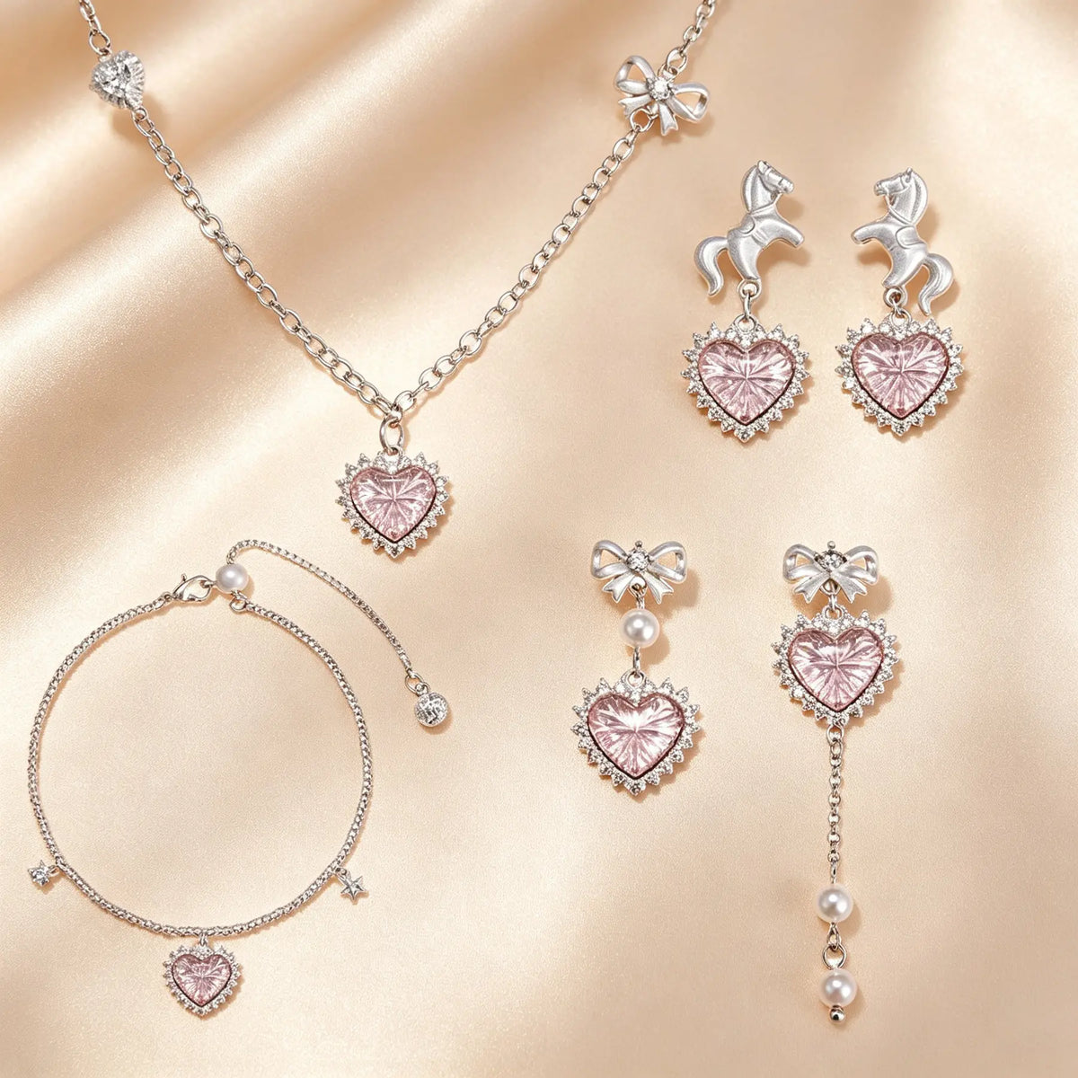 Pink heart princess jewellery set with crystal hearts, unicorn and bow earrings, pearl charm bracelet and necklace