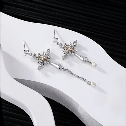 Vintage gothic cross earrings close-up, pair of silver cross drop earrings with rose gold flower centres and dangling pearl charms