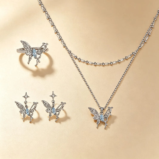 Butterfly jewellery set with blue gemstones, silver ring, stud earrings and layered necklace